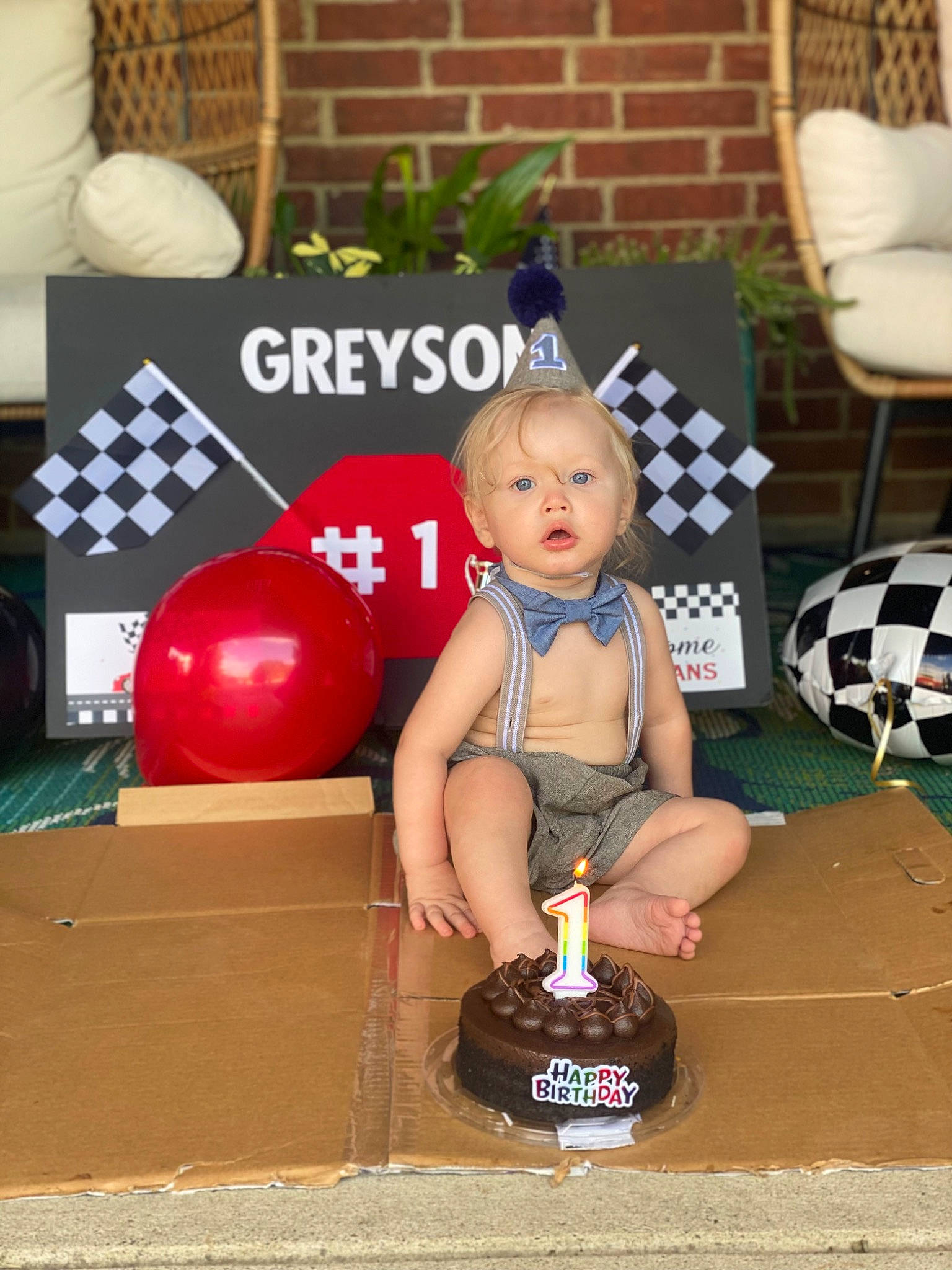 Greyson is registered to the contest to win money with this photo: baked_goods, baking, birthday, birthday_cake, birthday_candle, cake, cake_decorating_supply, candle, chair, child, dessert, event, flooring, fun, icing, person, sugar_cake, surprise, sweetness, table
