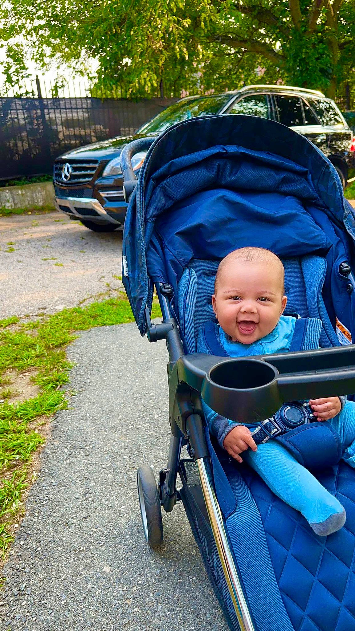 Semaj joined the competition — help win amazing prizes! auto_part, automotive_lighting, automotive_tire, baby, baby_carriage, car, electric_blue, fun, grass, leisure, motor_vehicle, person, plant, recreation, smile, tire, toddler, travel, tree, vehicle