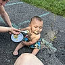 Raeleigh joined the competition — help win amazing prizes! baby, child, feeding, cake, food, outdoor, grass, pavement, chalk, tattoo, adult, hand, plate, sitting, smile, casual, summer, person, barefoot, shorts