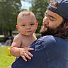 Raeleigh joined the competition — help win amazing prizes! baby, man, outdoor, park, sunlight, beard, cap, child, holding, portrait, grass, nature, daylight, person, tender, curious, casual, warm, family, bond