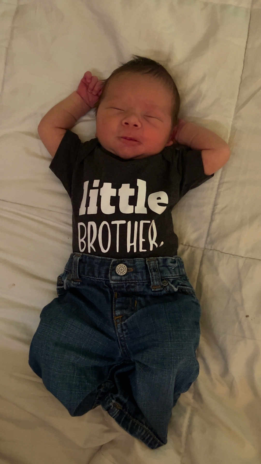 Carter joined the competition — help win amazing prizes! baby, newborn, infant, clothing, shirt, jeans, bed, sleeping, cute, child, person, toddler, smiling, resting, soft, fabric, text, casual, relaxing, indoor