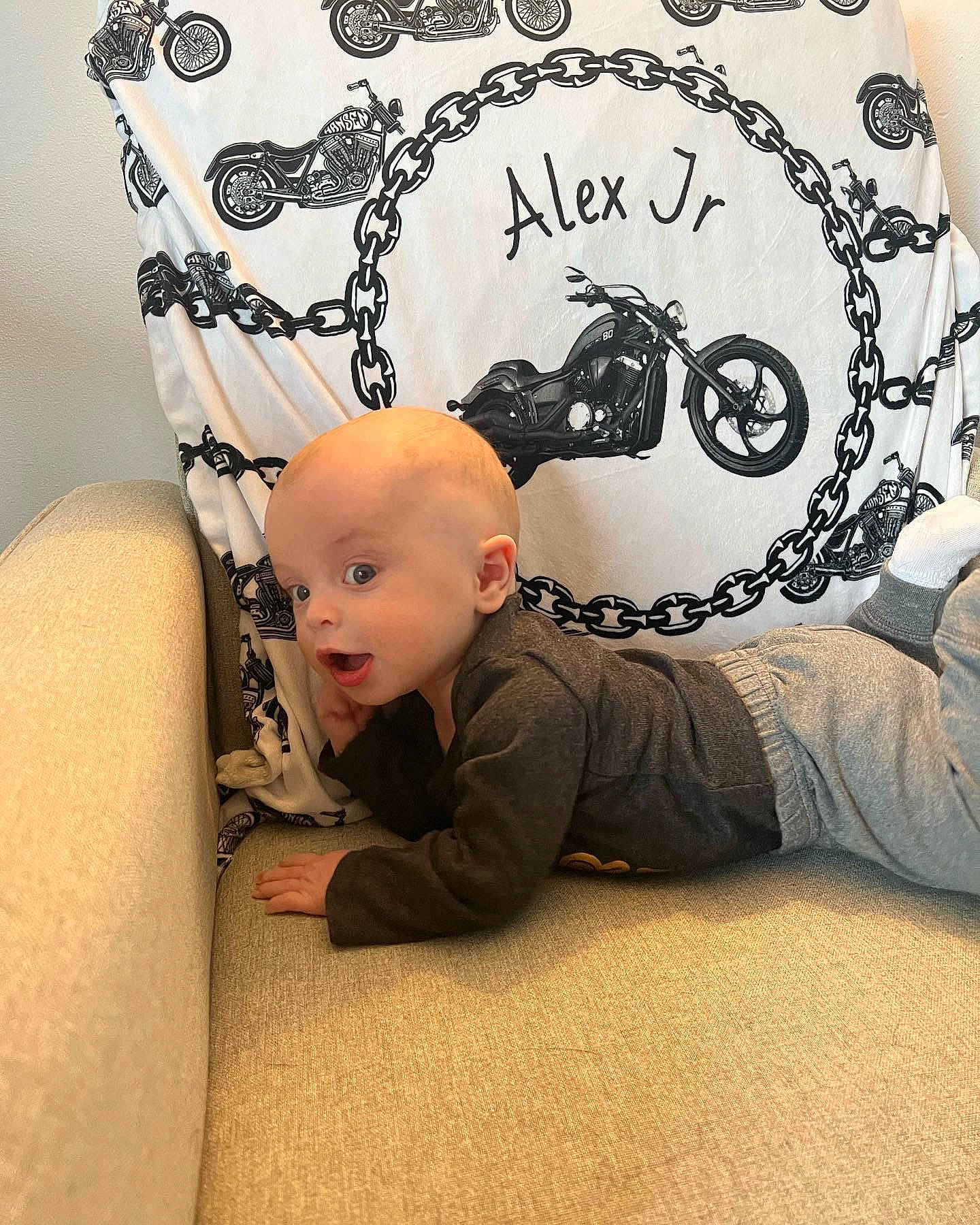 Alex joined the competition — help win amazing prizes! art, baby, baby_toddler_clothing, comfort, flooring, font, graphics, illustration, linens, logo, pattern, person, room, sitting, sleeve, surprise, t_shirt, toddler, visual_arts, wood