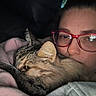 My Mommies joined the competition — help win amazing prizes! cat, person, glasses, tabby_cat, close_up, snuggling, blanket, indoor, cozy, face, fur, comfort, relaxation, eyewear, pet, warmth, resting, soft_texture, casual, home