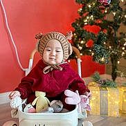 Teo joined the competition — help win amazing prizes! child, christmas_lights, christmas_tree, cute, decorations, festive, floor, gift_box, holiday, holiday_spirit, indoor, knitted_toys, playtime, red_clothing, reindeer_hat, smiling, toddler, toy_wagon, winter_clothing, young_child