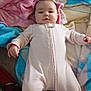 Anna is registered to the contest to win money with this photo: baby, blanket, child, clothing, cozy, cute, face, infant, laying_down, onesie, pink, portrait, soft, smile, toddler, warm, young_child, indoors, comfort, resting