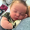 Atticus joined the competition — help win amazing prizes! baby, sleeping, infant, face, hand, mitten, hair, closeup, peaceful, rest, indoor, person, child, soft, camo_clothing, skin, cute, newborn, portrait, toddler