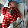 Ridge joined the competition — help win amazing prizes! newborn, baby, sleeping, onesie, red_clothing, striped_clothing, dog_applique, blanket, hospital_bassinet, birth_card, footprints, infant, indoors, soft_light, cozy, resting, child, person, cute, toddler