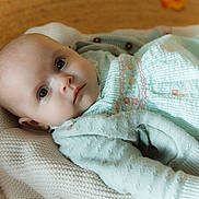 Blair joined the competition — help win amazing prizes! baby, infant, blanket, knit, green_clothing, pastel, face, portrait, indoors, pumpkin, autumn, soft_lighting, closeup, cute, child, young, peaceful, laying_down, warm_colors, cozy