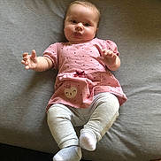Violet is registered to the contest to win money with this photo: baby, bodypart, clothing, couch, cushion, face, finger, furniture, hand, head, homedecor, hosiery, newborn, pants, person, photography, portrait, sitting, sock, t_shirt