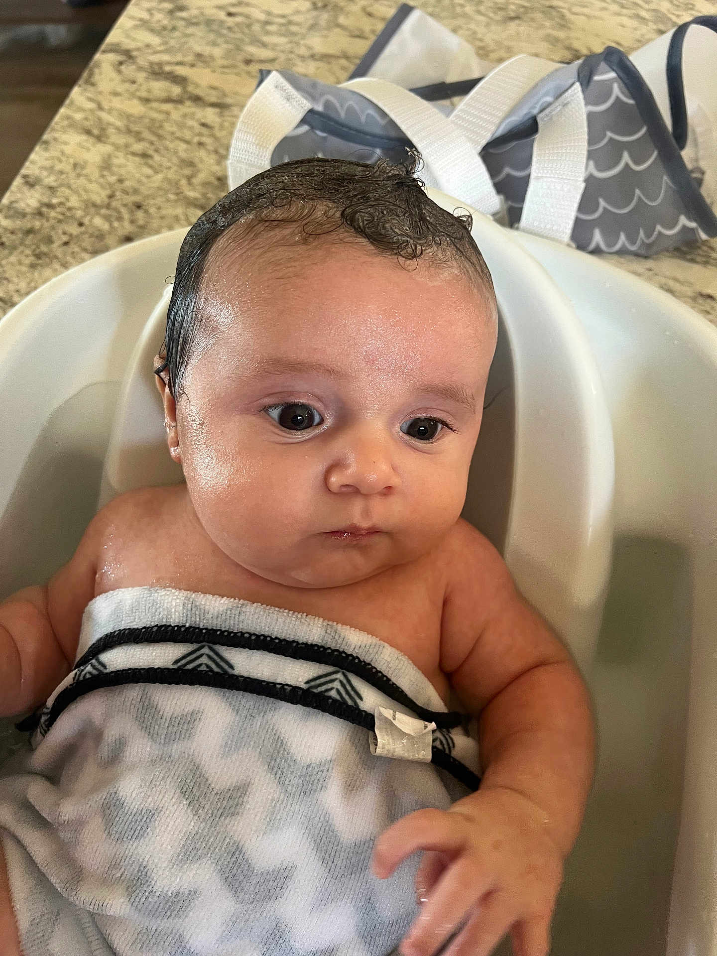 Kashton joined the competition — help win amazing prizes! baby, bathtub, towel, wet_hair, infant, water, bath_time, child, skin, face, hand, expression, indoors, sink, countertop, bathroom, cute, young_child, person, portrait