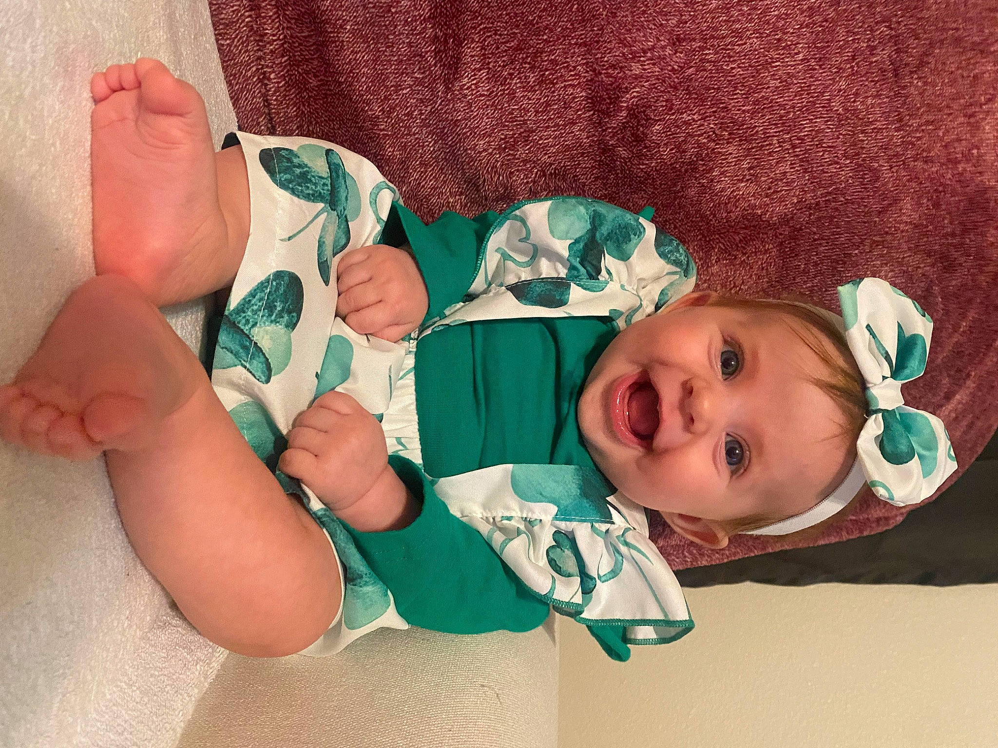 Mallory is registered to the contest to win money with this photo: arm, baby, baby_toddler_clothing, cheek, comfort, eye, face, finger, gesture, hand, happy, headgear, human_body, mouth, person, product, skin, sleeve, smile, textile