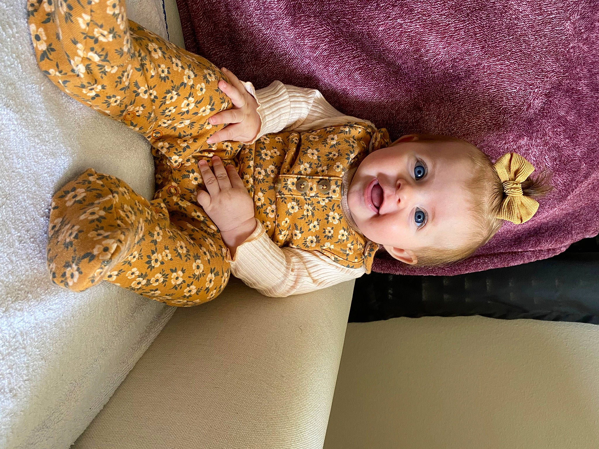 Mallory is registered to the contest to win money with this photo: baby, baby_products, baby_toddler_clothing, child, embellishment, eye, fashion_accessory, hat, human_leg, magenta, metal, pattern, peach, person, room, sleeve, smile, textile, toddler, wrist