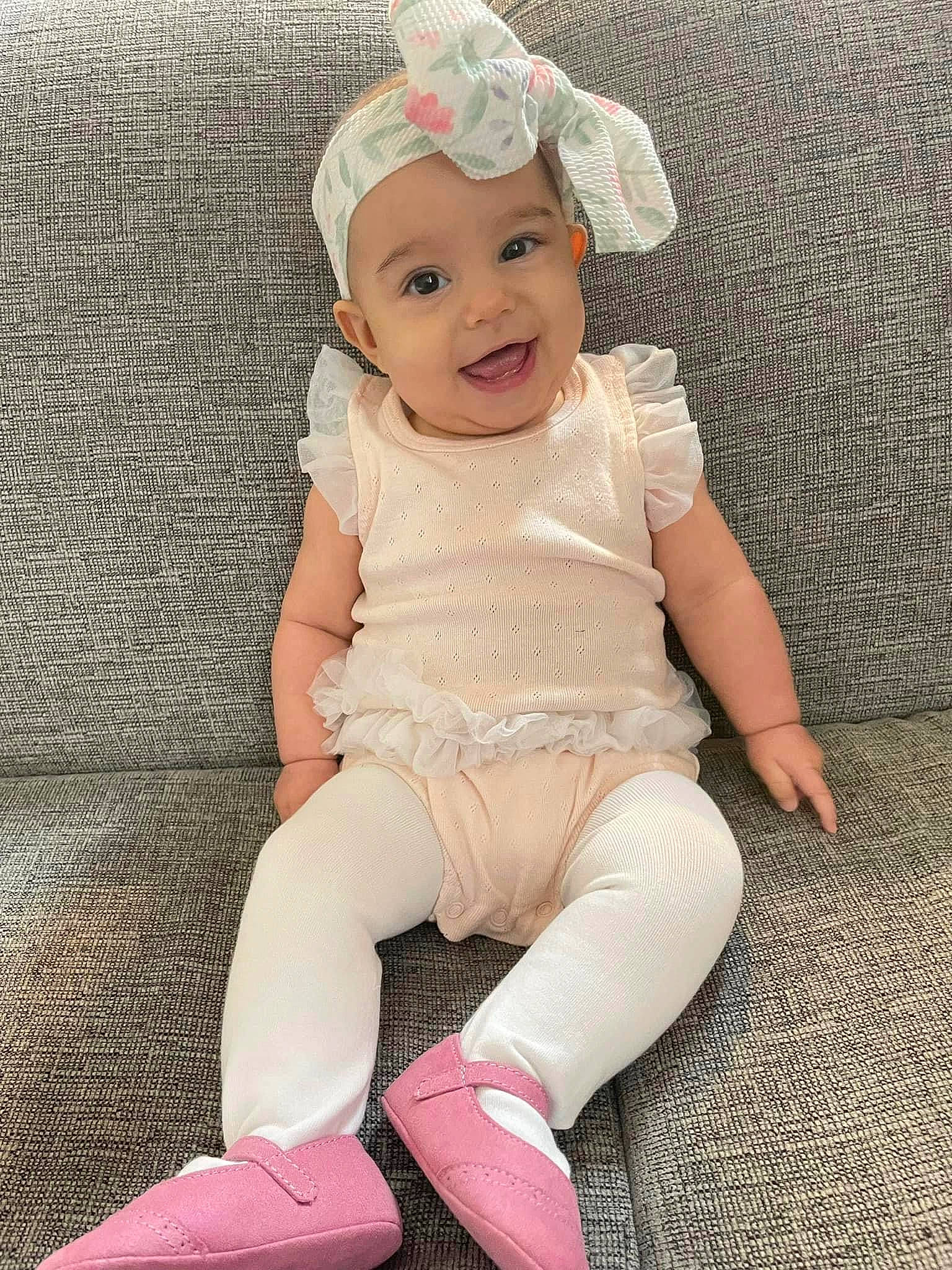 Noelle joined the competition — help win amazing prizes! baby, baby_toddler_clothing, cap, child, face, facial_expression, fashion_accessory, happy, headwear, human_leg, joy, knee, lip, magenta, pattern, person, pink, product, skin, sleeve