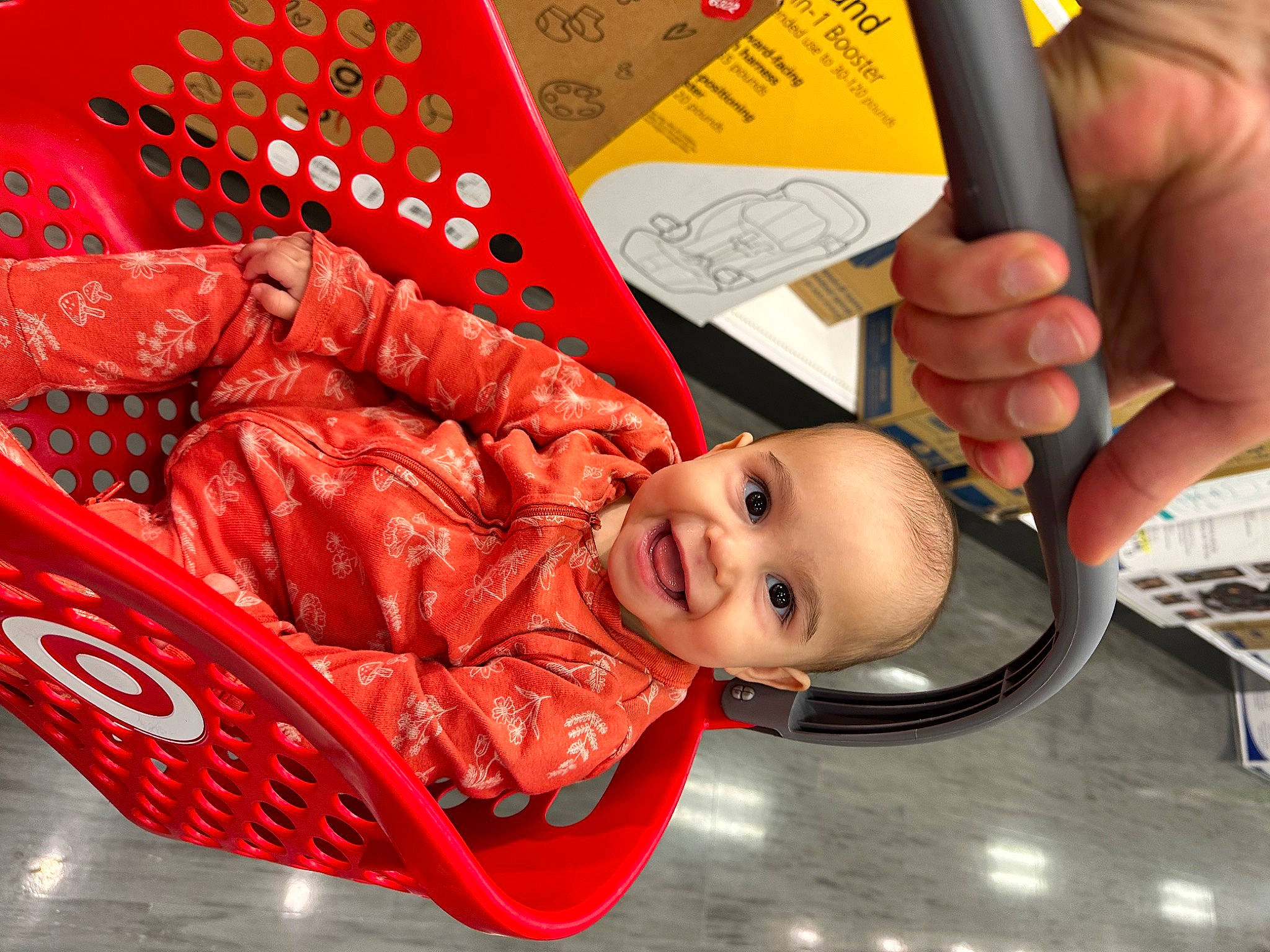 Noelle is registered to the contest to win money with this photo: baby, baby_products, carmine, child, comfort_food, event, fashion_accessory, happy, joy, person, play, room, smile, thumb, toddler, wood