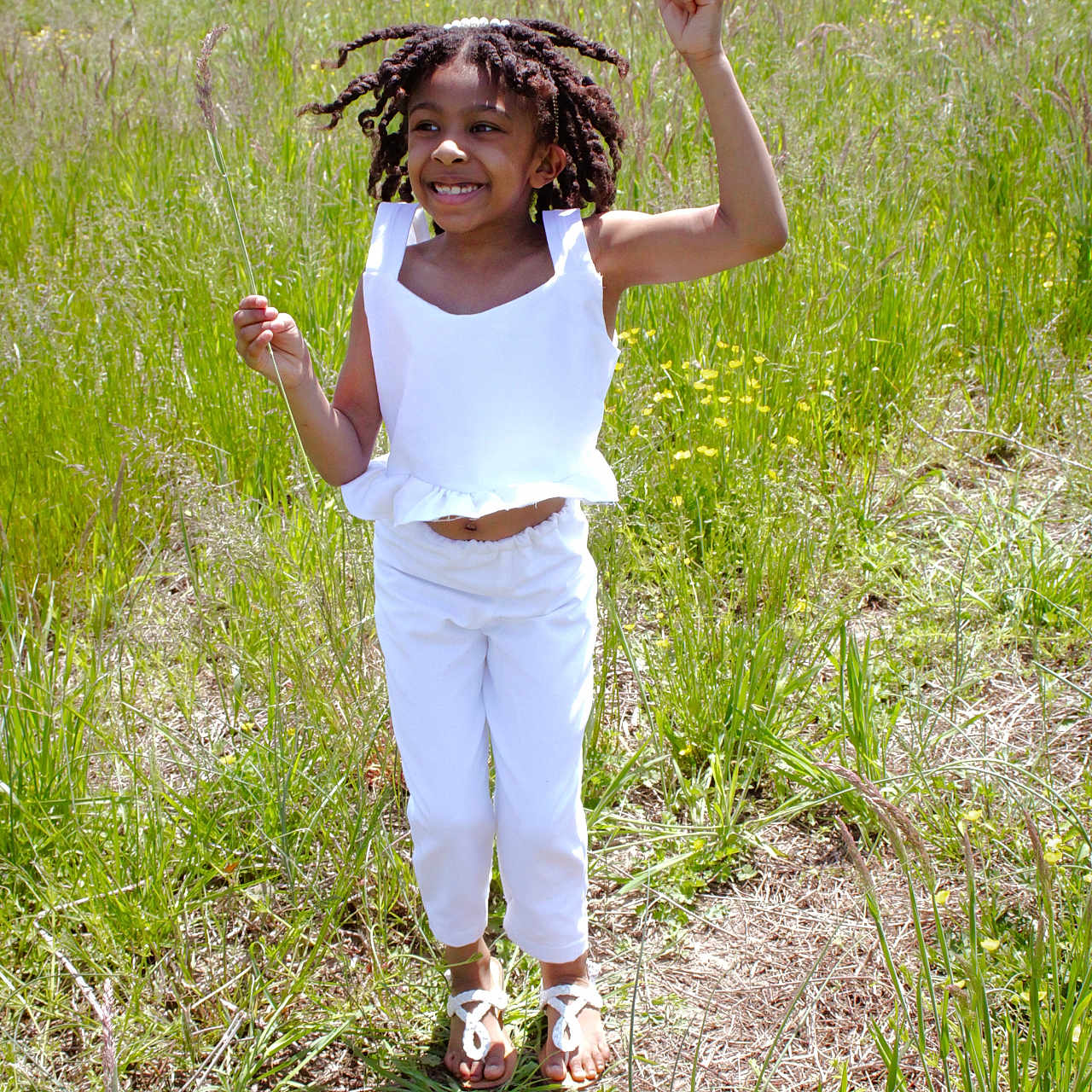 Chandler Quinn is registered to the contest to win money with this photo: bodypart, child, clothing, face, female, finger, footwear, girl, grass, hand, happy, head, pants, person, photography, plant, portrait, shorts, smile, summer