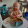 baby, child, cute, eating, face_paint, floor_mat, food, happy, high_chair, indoor, kitchen, meal_time, messy, person, plate, smiling, spaghetti, strawberry, toddler, wood_floor
