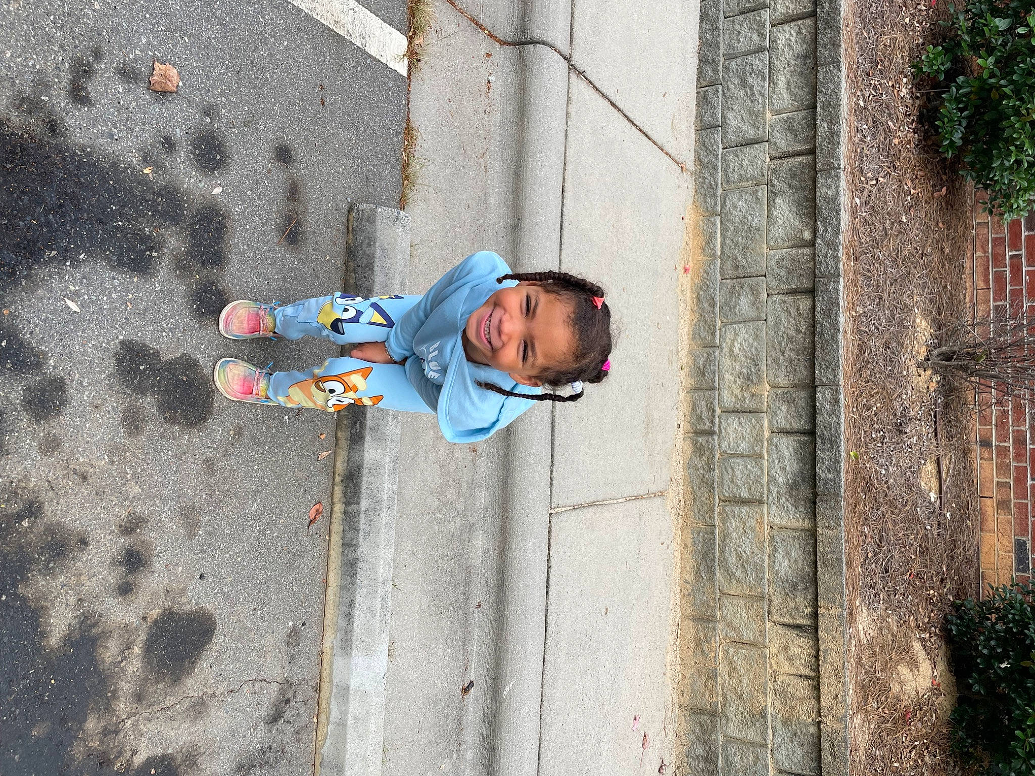 Harmonee is registered to the contest to win money with this photo: asphalt, child, city, cobblestone, concrete, electric_blue, facade, fun, joy, leisure, pedestrian, person, plant, recreation, road, road_surface, shadow, sidewalk, street, sunglasses