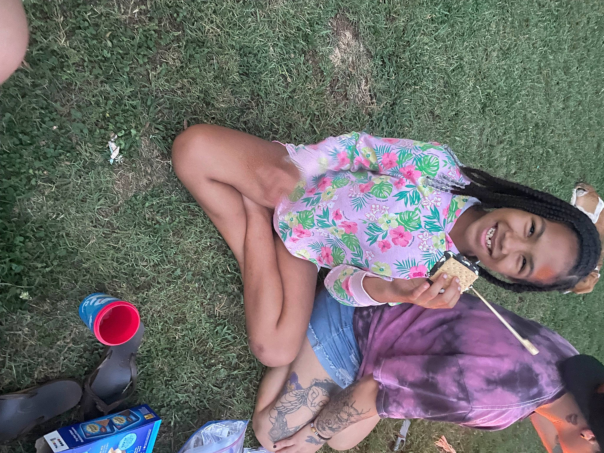 Payton is registered to the contest to win money with this photo: child, flip_flops, foot, fun, grass, happy, human_leg, joy, lap, leg, leisure, magenta, pattern, people_in_nature, person, pink, recreation, sandal, shorts, sitting