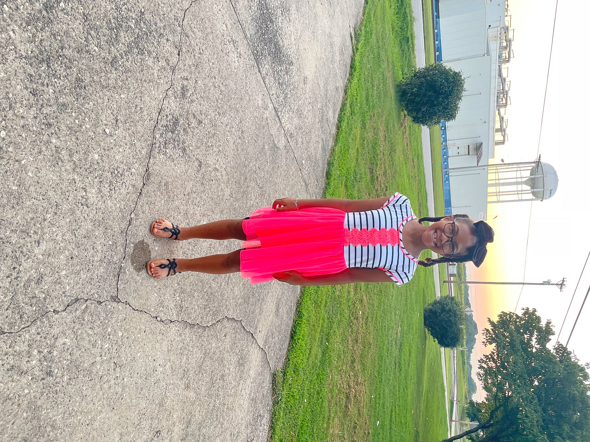 Payton is registered to the contest to win money with this photo: asphalt, boot, dress, fun, grass, human_leg, joy, landscape, leisure, line, people_in_nature, person, plant, road, road_surface, shadow, sidewalk, sky, tints_and_shades, tree