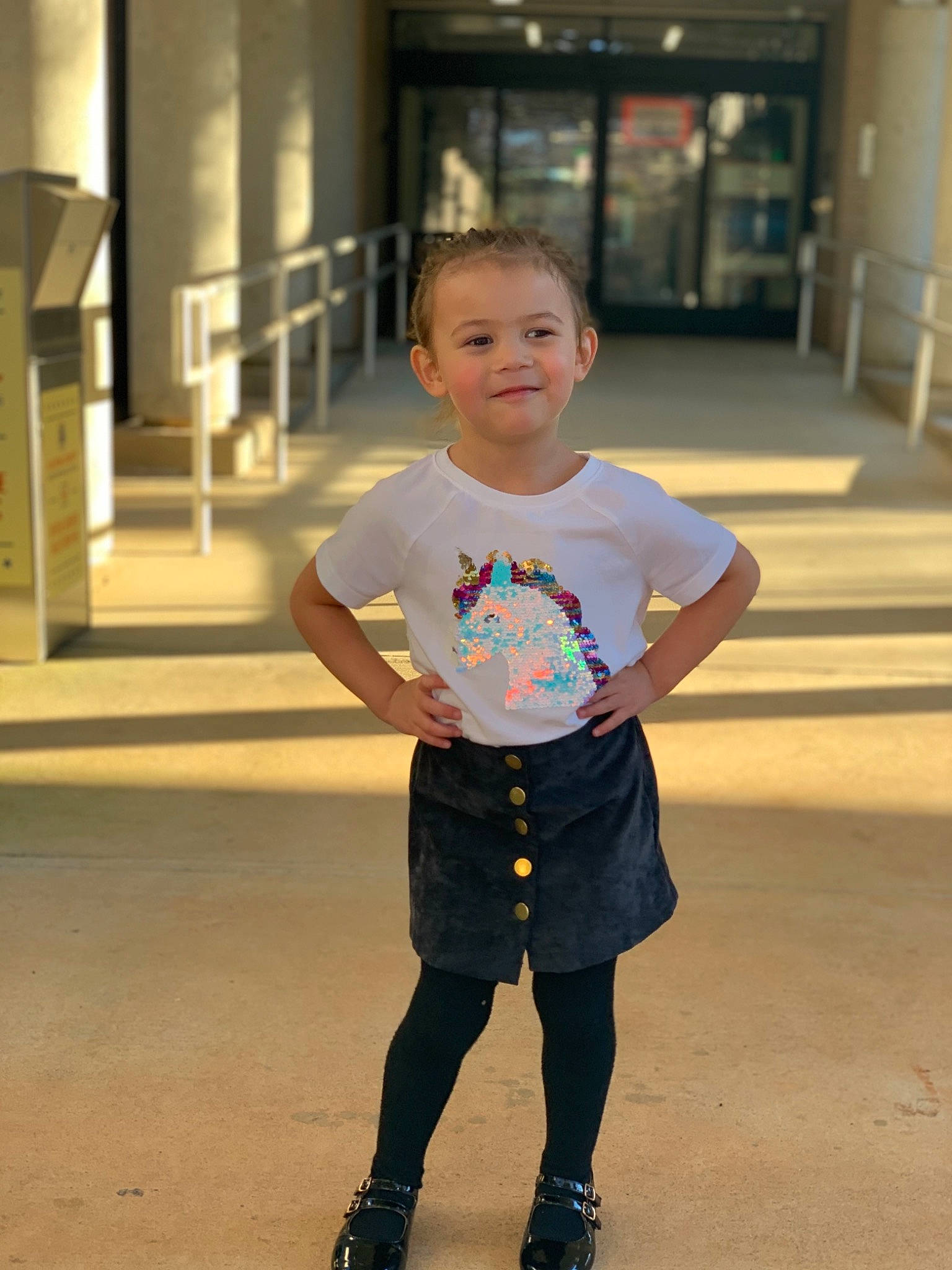 Emily is registered to the contest to win money with this photo: boot, child, denim, electric_blue, face, fashion_design, flooring, fun, happy, human_leg, joy, knee, leisure, person, shorts, sleeve, sportswear, street_fashion, t_shirt, toddler
