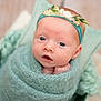 Mila is registered to the contest to win money with this photo: baby, infant, wrapped, blanket, headband, flower, soft, cozy, pillow, portrait, cute, newborn, child, closeup, blue, teal, face, looking, indoors, sleepy