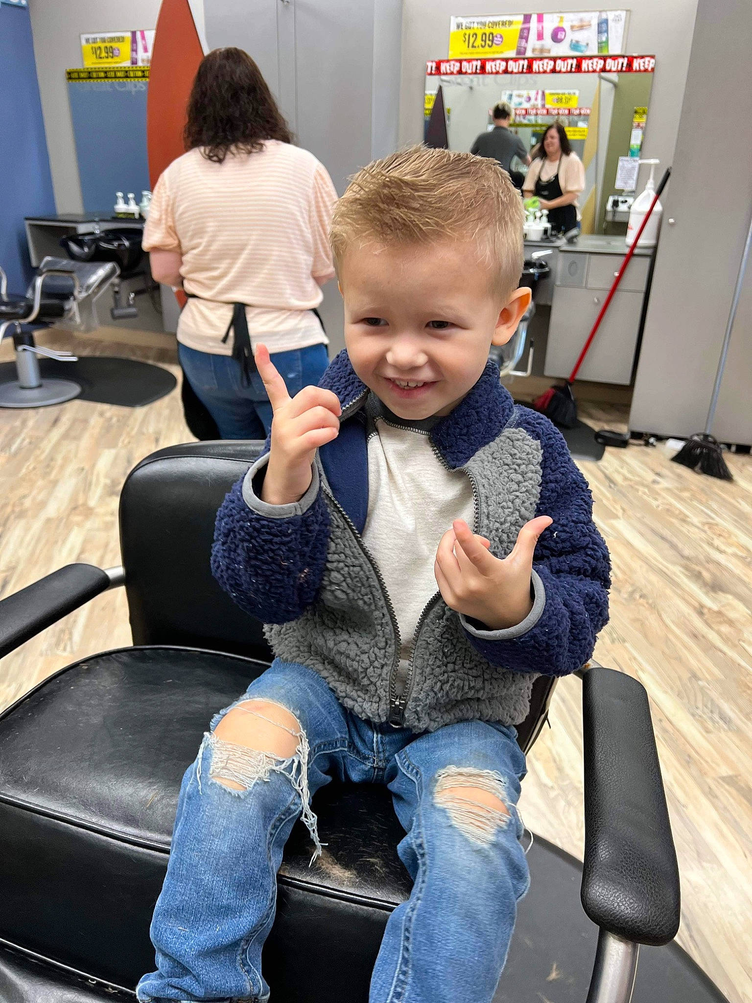 Kaiden joined the competition — help win amazing prizes! automotive_design, blurred, chair, comfort, electric_blue, event, flooring, jeans, joint, joy, lap, leg, luggage_and_bags, person, shoe, sitting, smile, sneakers, standing, toddler