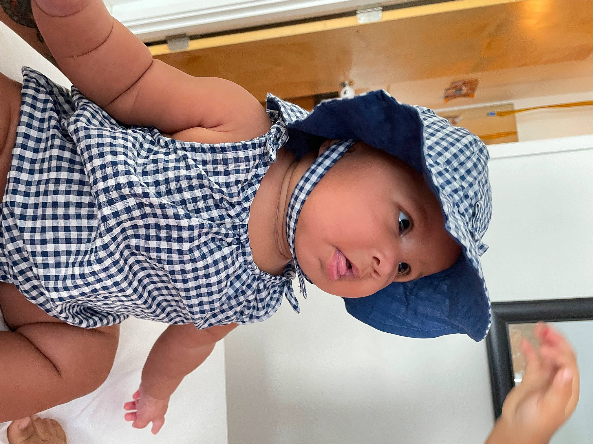 Rikki is registered to the contest to win money with this photo: baby_toddler_clothing, comfort, elbow, finger, happy, hat, headwear, joint, knee, leg, neck, person, plaid, shoulder, skin, sleeve, sunglasses, tartan, thigh, toddler