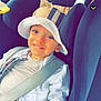 Kassim Menassel participe au concours pour gagner de l'argent avec cette photo : child, toddler, car_seat, bucket_hat, seat_belt, smile, white_jacket, car_interior, safety, happy, young_child, seat, headwear, casual_clothing, infant, portrait, travel, baby, blue_eyes, cute