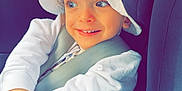 Kassim Menassel a rejoint le concours — aidez-le/la à gagner de superbes lots ! baby, baseballcap, bonnet, cap, car, car_interior, carseat, clothing, cushion, face, hat, head, homedecor, person, photography, portrait, sitting, sunhat, transportation, vehicle