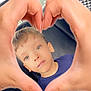 blue_shirt, boy, candid, car_seat, casual, child, closeup, expression, face, family, hair, hands, heart_shape, indoor, love, person, portrait, seat, skin, window