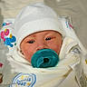 newborn, baby, infant, child, portrait, face, pacifier, white_hat, blanket, swaddled, hospital, bedding, closeup, looking_at_camera, cozy, blue, white, sleepwear, indoors, photography