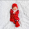 adorable, baby, child, cozy, cute, headband, indoors, infant, lying_down, newborn, peaceful, portrait, red_dress, resting, sleeping, small_hands, socks, soft_texture, warm_clothing, white_blanket
