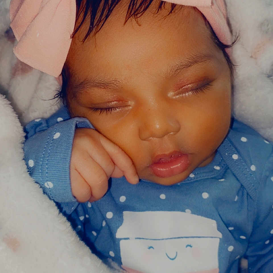 Olivia is registered to the contest to win money with this photo: baby, cheek, child, chin, eyebrow, eyelash, facial_expression, finger, forehead, gesture, happy, iris, lip, mouth, nose, pink, product, skin, textile, toddler