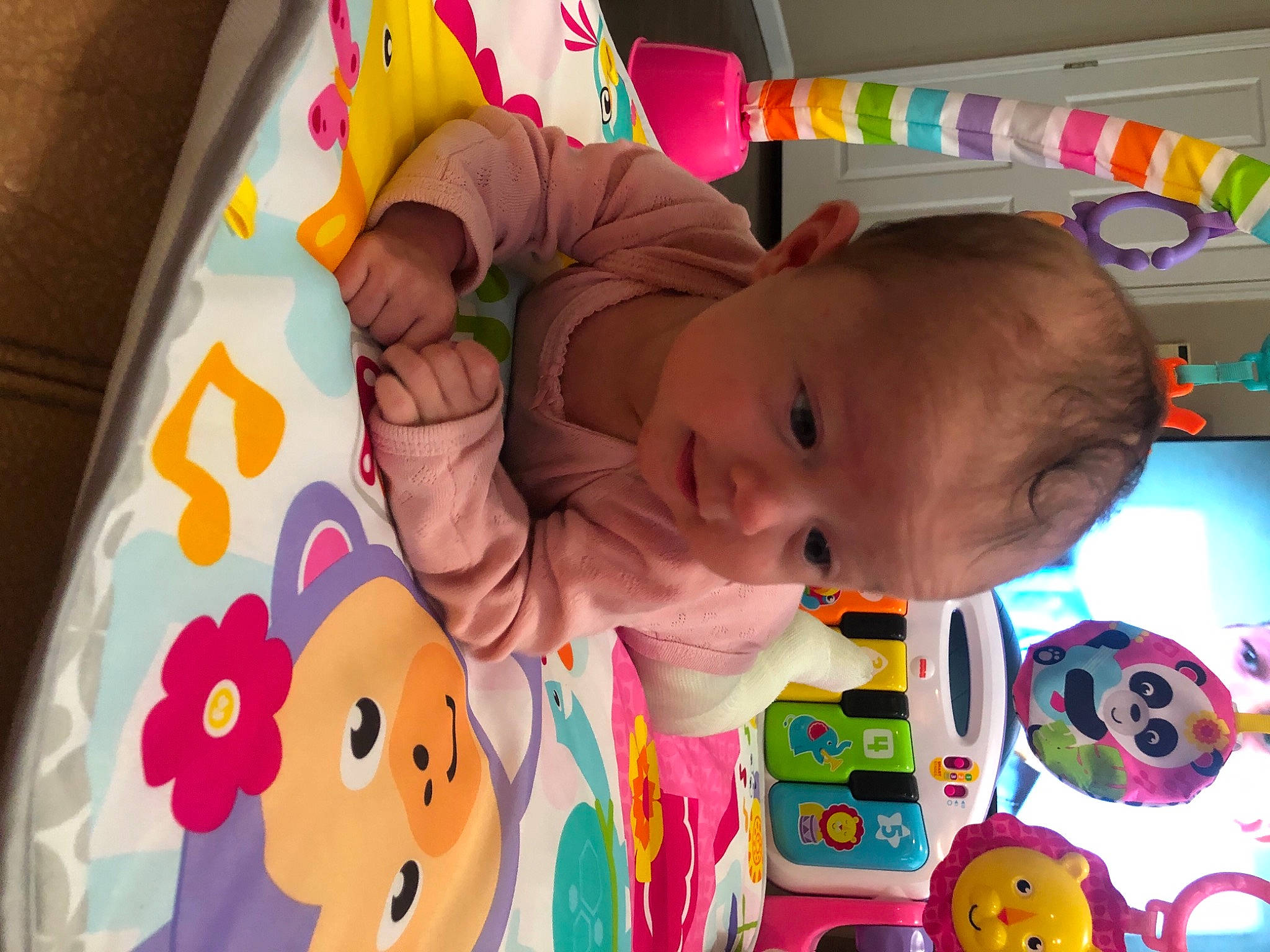 Madison is registered to the contest to win money with this photo: baby, baby_playing_with_toys, baby_products, baby_toddler_clothing, baby_toys, bedtime, cheek, child, eye, fun, happy, infant_bed, person, pink, play, product, room, stuffed_toy, toddler, toy