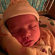 Destiny joined the competition — help win amazing prizes! baby, sleeping, blanket, hat, closeup, infant, face, cozy, soft, indoors, bed, peaceful, child, warm_lighting, portrait, newborn, cushion, rest, nursery, cute