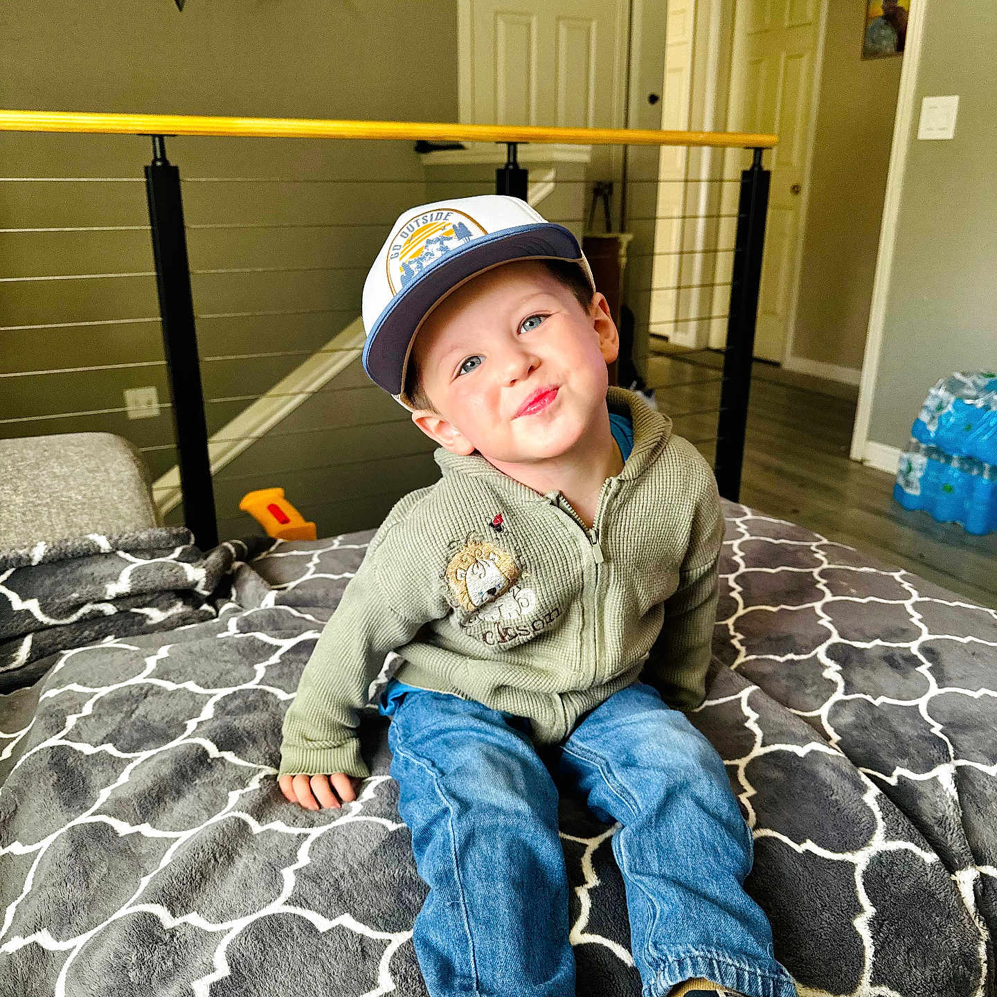 Jackson joined the competition — help win amazing prizes! baseballcap, boy, cap, child, clothing, door, face, footwear, furniture, hat, head, jeans, male, pants, person, photography, portrait, shoe, sitting, sneaker
