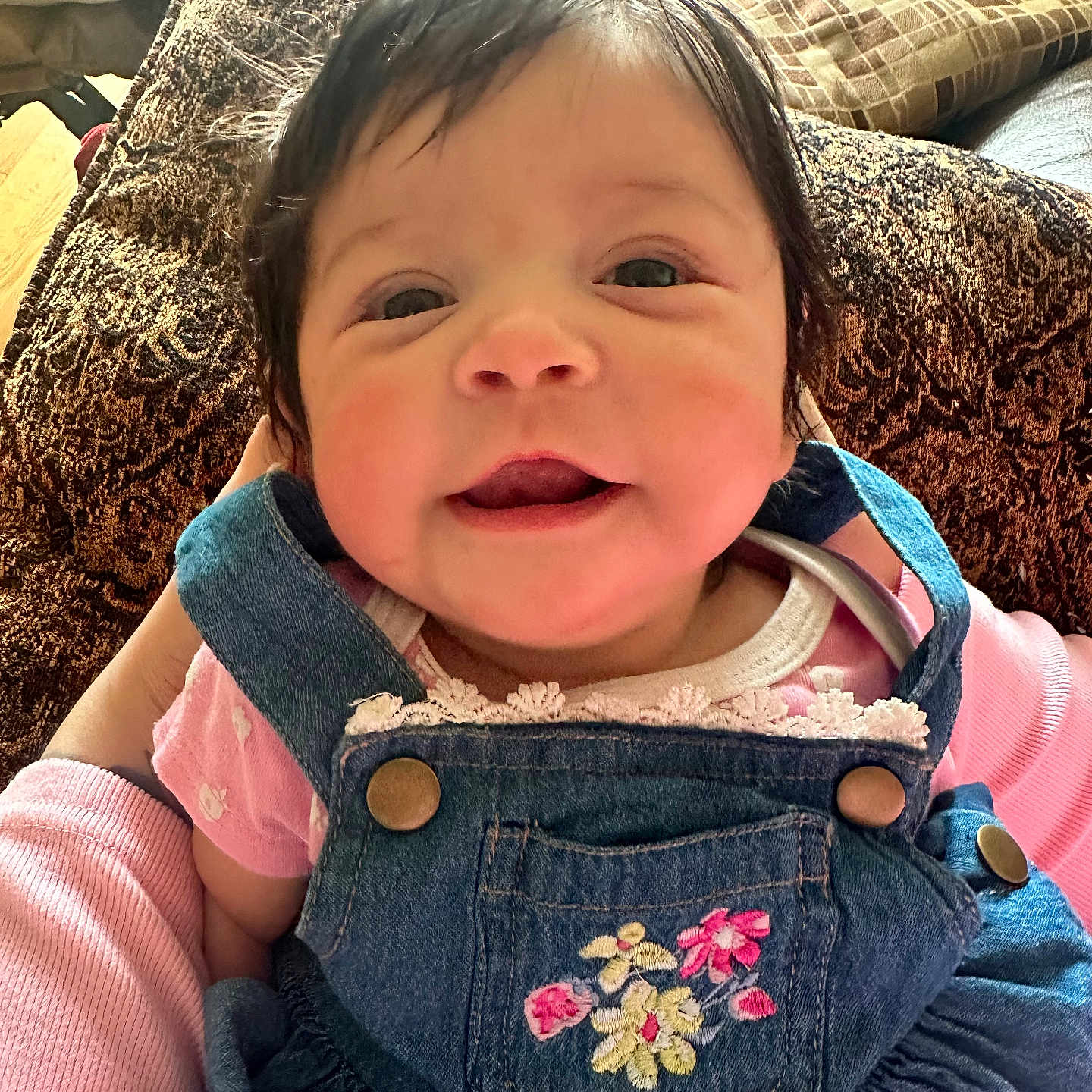 Josiahlyn joined the competition — help win amazing prizes! baby, clothing, coat, couch, cushion, face, furniture, happy, head, homedecor, jacket, jeans, knitwear, pants, person, photography, portrait, smile, sweater, vest