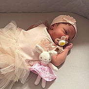 Sophia joined the competition — help win amazing prizes! baby, newborn, pacifier, plush_toy, bunny, pink_skirt, hat, flower, tulle_skirt, sleeping, infant, soft_toys, bed, mattress, cute, resting, child, clothing, indoors, peaceful