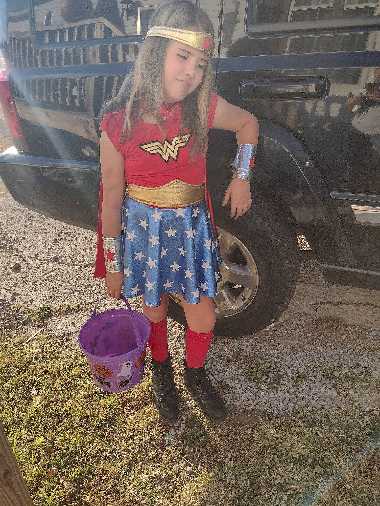 Madelyn joined the competition — help win amazing prizes! asphalt, automotive_design, automotive_exterior, automotive_lighting, automotive_tire, automotive_wheel_system, bumper, fender, headwear, high_heels, knee, leg, motor_vehicle, person, shoe, shorts, sneakers, thigh, tire, vehicle_door