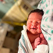 Nathaniel joined the competition — help win amazing prizes! newborn, baby, sleeping, smiling, blanket, hospital, infant, wrapped, cute, portrait, face, skin, resting, comfort, healthcare, person, bed, tender, peaceful, closeup