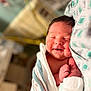 newborn, baby, sleeping, smiling, blanket, hospital, infant, wrapped, cute, portrait, face, skin, resting, comfort, healthcare, person, bed, tender, peaceful, closeup