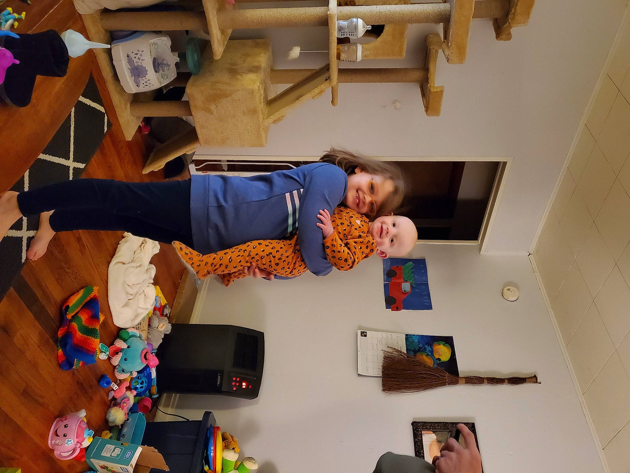 Patience is registered to the contest to win money with this photo: balance, child, comfort, floor, flooring, fun, hardwood, hat, joy, knee, person, play, room, t_shirt, toddler, walking_shoe, wood