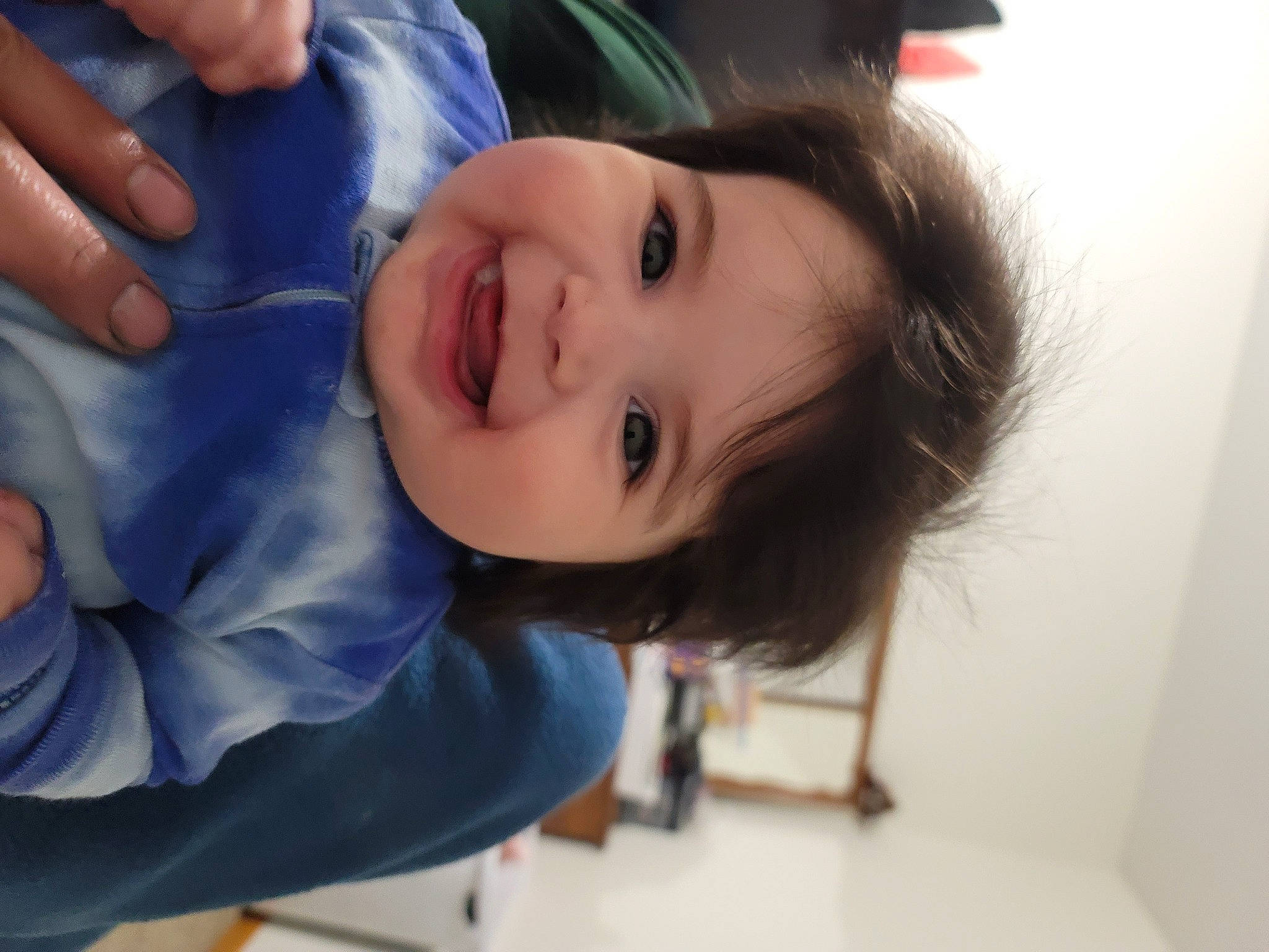 Evelyn is registered to the contest to win money with this photo: baby, baby_toddler_clothing, cheek, child, electric_blue, eye, eyelash, fun, gesture, hand, happy, human_body, iris, joy, lip, nail, nose, person, skin, smile