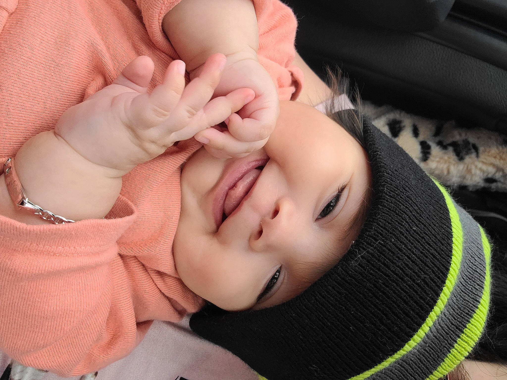 Evelyn joined the competition — help win amazing prizes! arm, baby, cheek, chin, ear, eye, eyebrow, eyelash, face, finger, gesture, hand, happy, head, headwear, human_body, lip, mouth, neck, nose