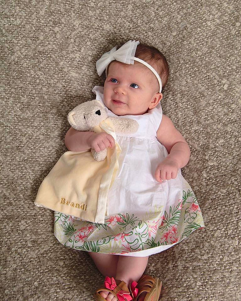 Brandi is registered to the contest to win money with this photo: child, girl, hair_accessory, infant, person, pink, product, skin, toddler