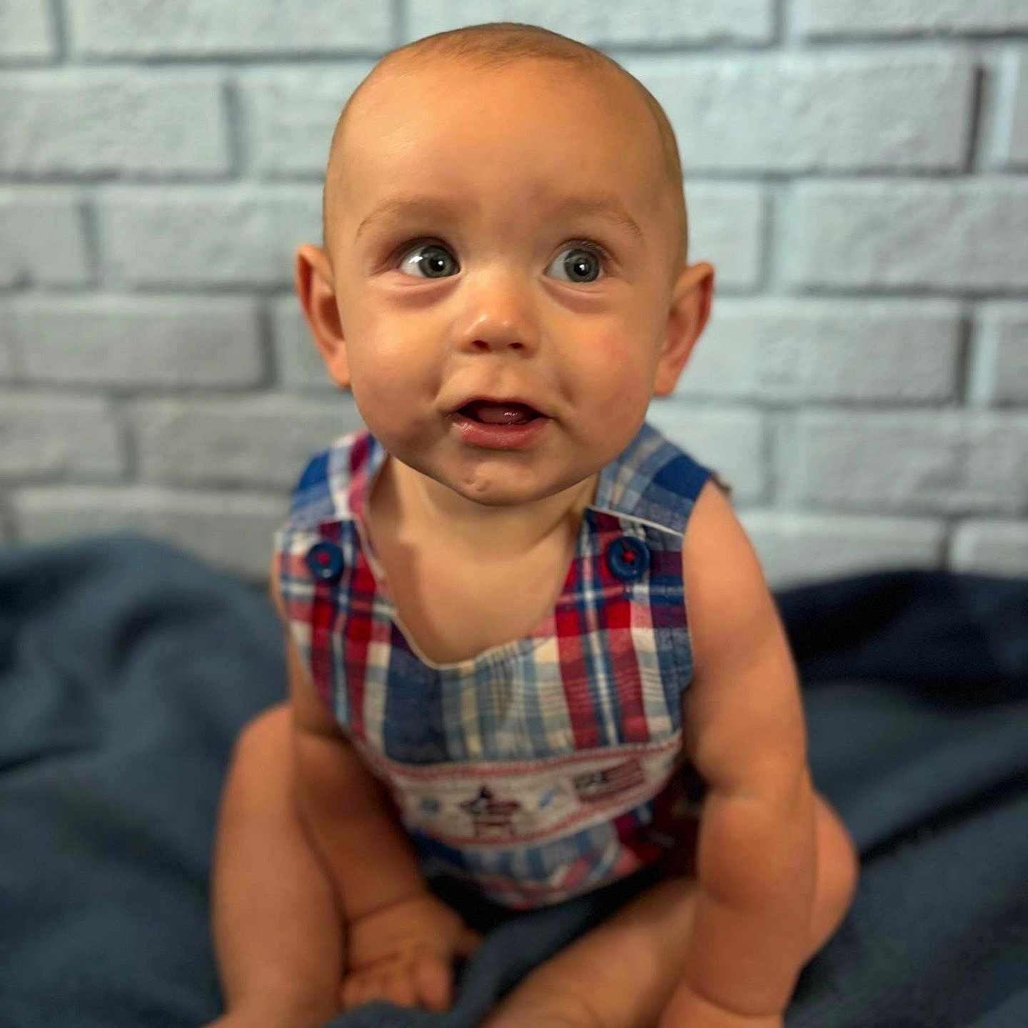 Allen is registered to the contest to win money with this photo: baby, babycrawling, clothing, crawling, face, head, newborn, pants, person, photography, portrait, sitting