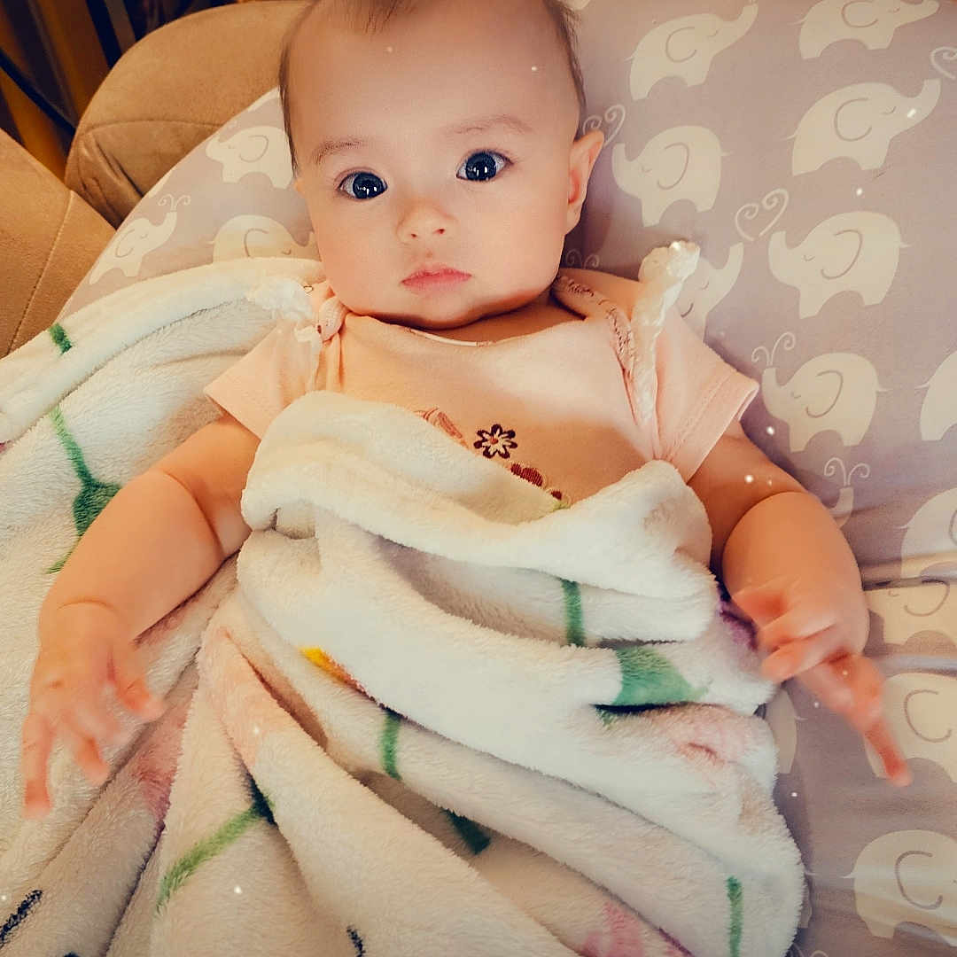 Lilah joined the competition — help win amazing prizes! abdomen, arm, baby, baby_products, baby_safety, baby_toddler_clothing, bedding, cheek, chest, comfort, eyelash, hand, linens, nail, peach, room, sitting, skin, thumb, toddler