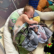 Journey joined the competition — help win amazing prizes! baby, sleeping, bottle, blanket, pillow, playpen, toy, stuffed_animal, connect_four, floor_mat, child, diaper, indoor, cozy, cuddle, nap, soft, comfort, peaceful, play_area