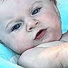 Journey is registered to the contest to win money with this photo: baby, child, face, blue_eyes, skin, arm, water, float, starfish_pattern, bath_time, portrait, closeup, relaxing, infant, cute, expression, swimming_pool, background_blur, phone_screen_overlay, lock_screen
