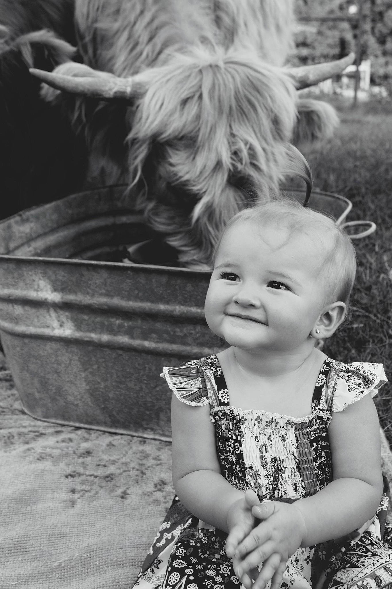 Danni is registered to the contest to win money with this photo: baby, baby_toddler_clothing, black, black_and_white, carnivore, companion_dog, dog, dress, eye, flash_photography, fun, happy, iris, joy, people_in_nature, person, photograph, skin, smile, style